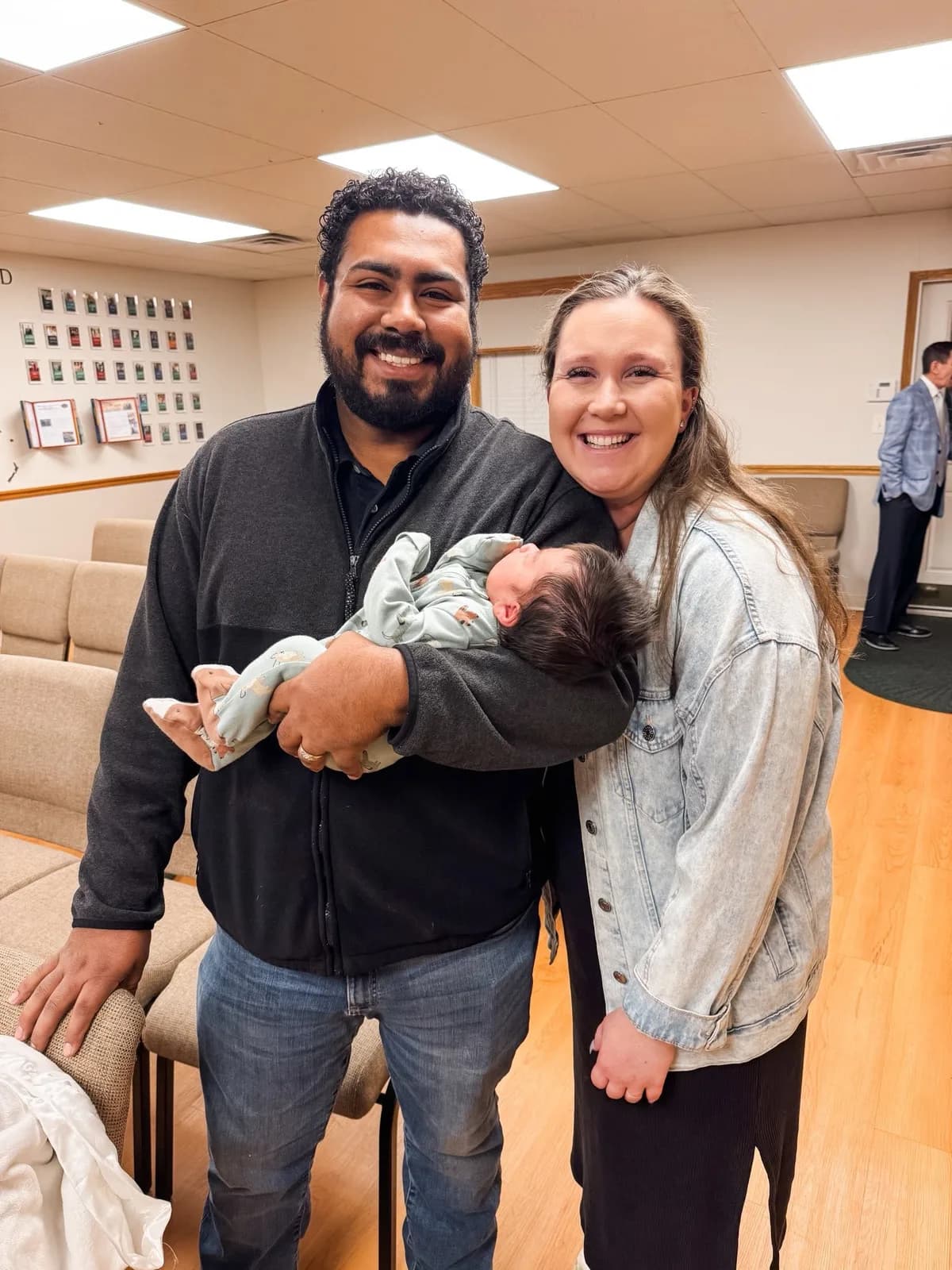 A young family with their newborn at Grace Baptist Church