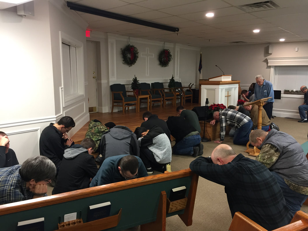 Praying together at the altar